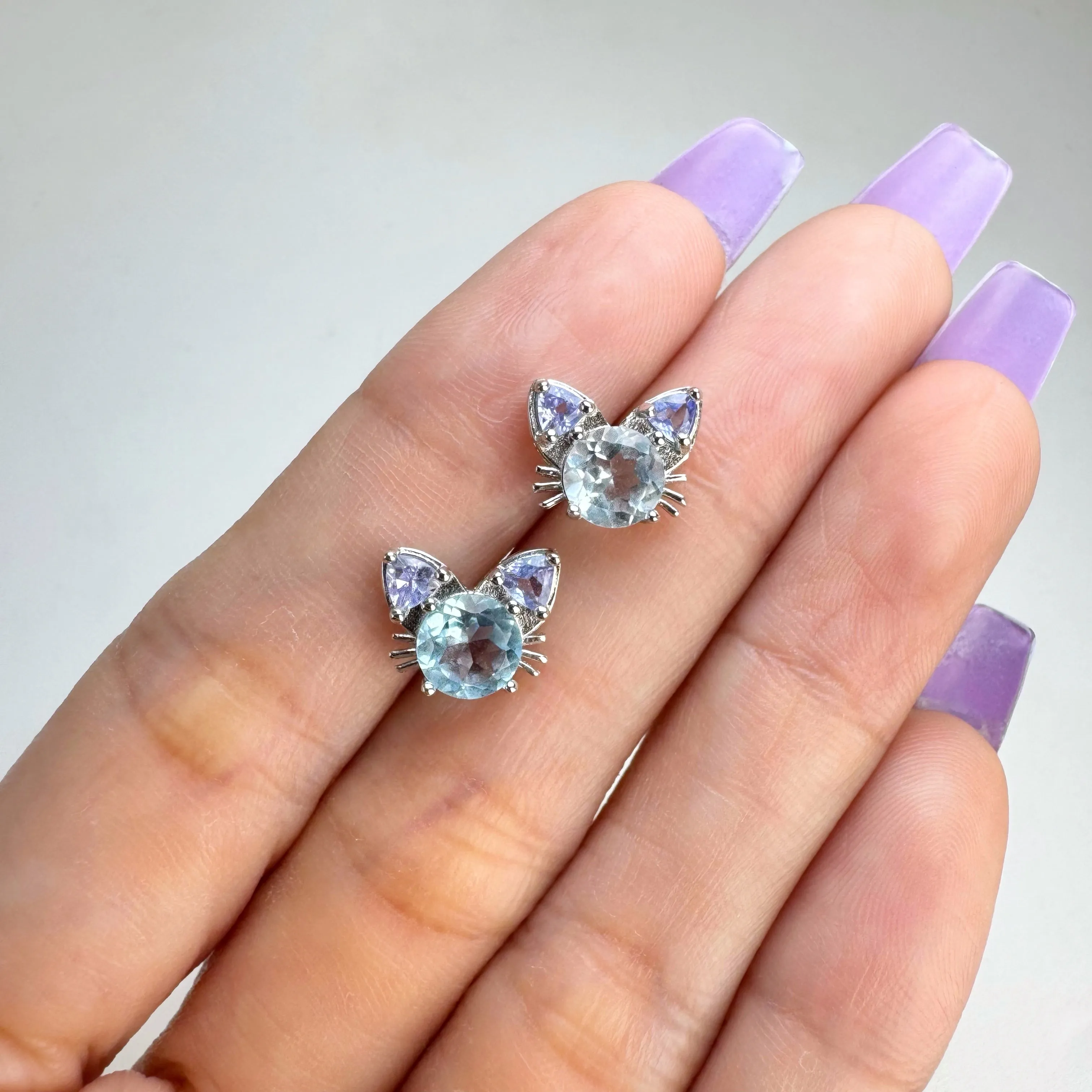 6 mm. Round Cut Sky Blue Brazilian Topaz and Tanzanite Cat Earrings