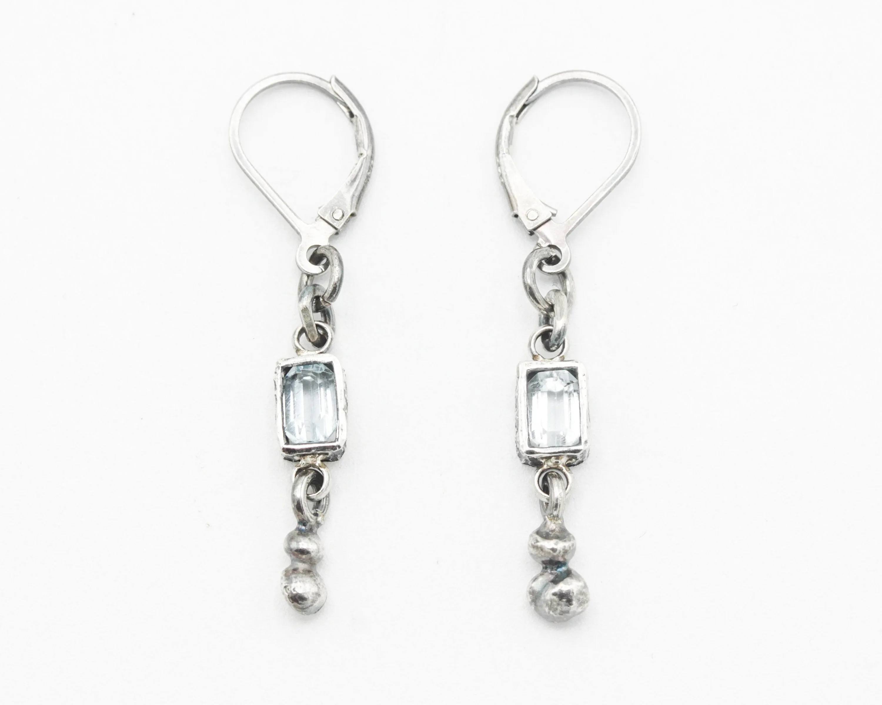 Earrings Princess cut Swiss blue topaz in silver bezel setting with silver peanut on sterling silver hooks style
