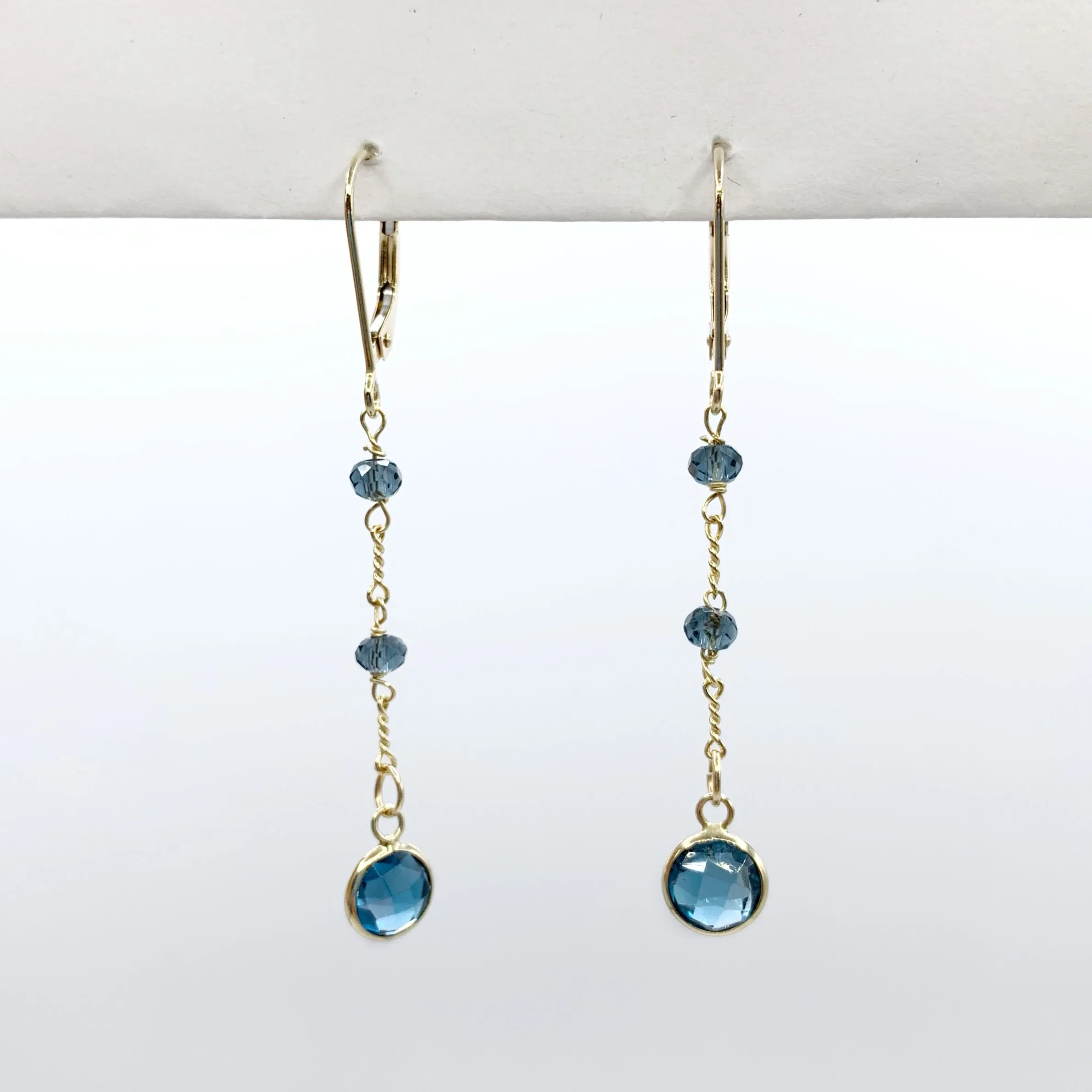 Electric Blue Topaz Floating on a Golden Chain