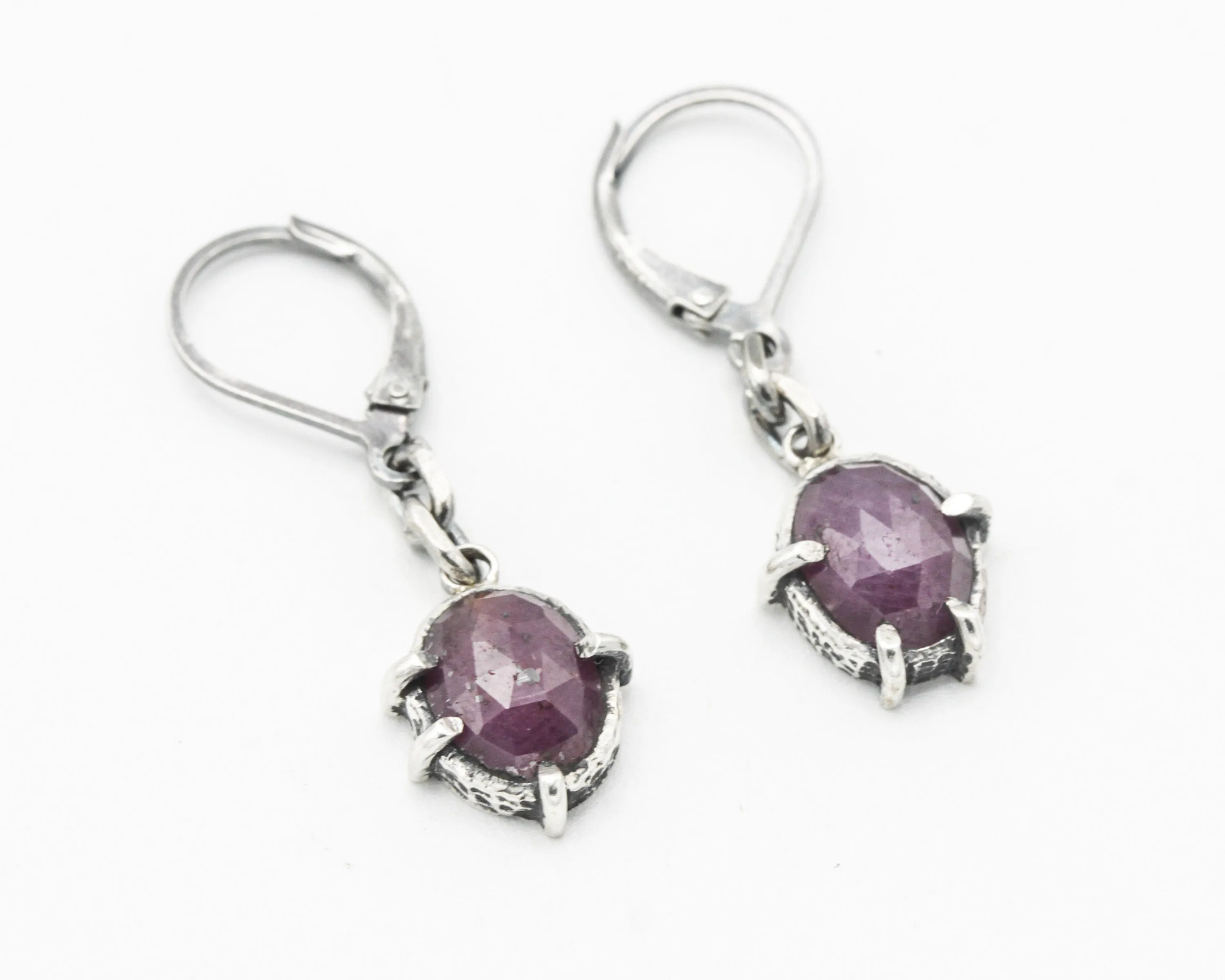 Pink sapphire oval faceted earrings in bezel and prongs setting with silver chain on oxidized sterling silver hooks