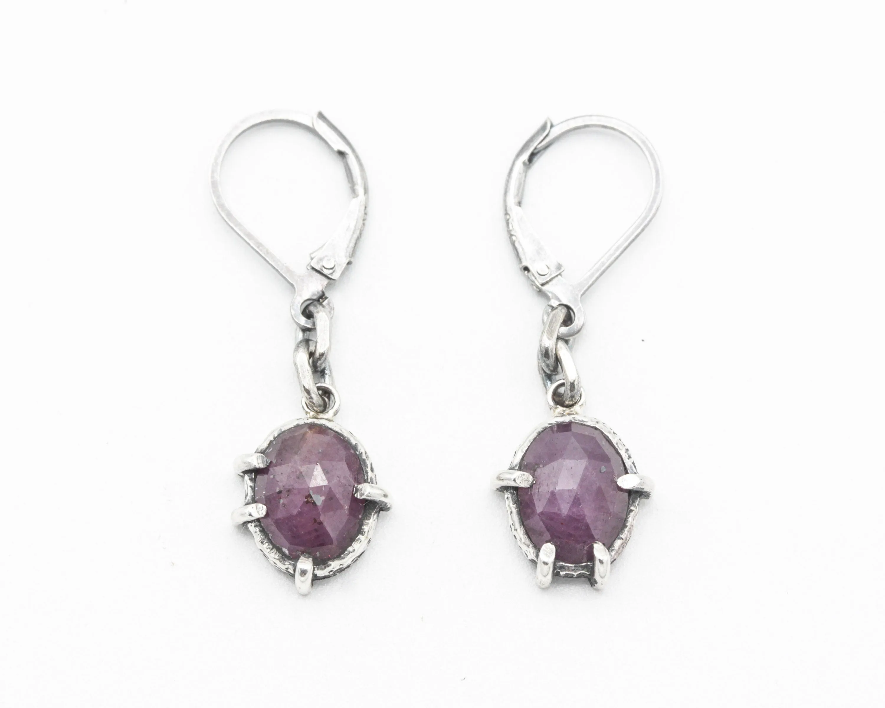 Pink sapphire oval faceted earrings in bezel and prongs setting with silver chain on oxidized sterling silver hooks