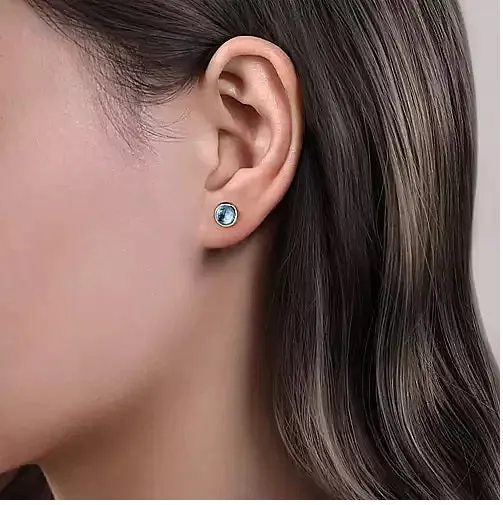Sterling Silver Round Blue Topaz Bezel Set Stud Earrings.